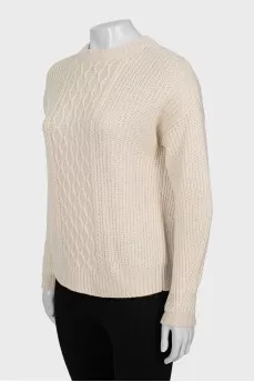 Beige sweater with a relief pattern