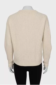 Beige sweater with a relief pattern