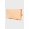 Beige leather clutch