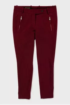 Tapered trousers with zippers at the bottom