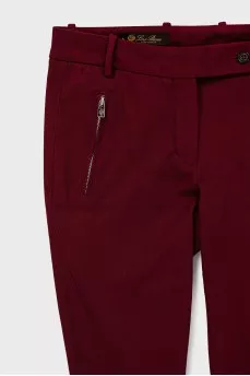 Tapered trousers with zippers at the bottom