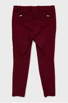 Tapered trousers with zippers at the bottom