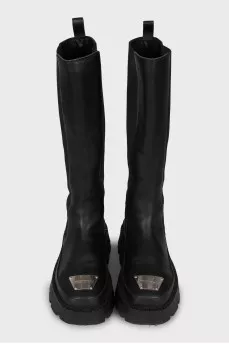 Boots with metal decoration on the toe