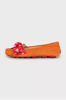 Suede moccasins decorated with bows