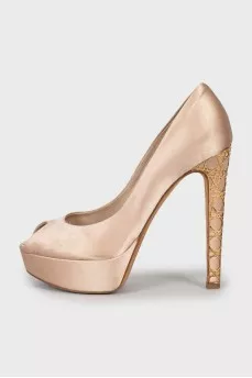 Shoes with gold decor on the heel