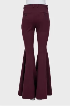 Red flared trousers with tag