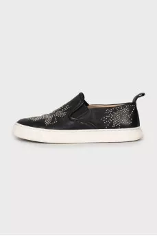 Leather slip-ons with metal decor