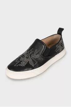 Leather slip-ons with metal decor