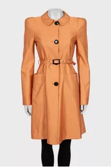 Orange trench coat with belt