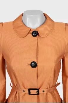 Orange trench coat with belt