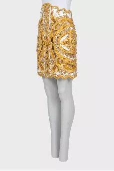 Skirt decorated with golden beads