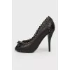 Black leather pumps with decorative stitching