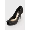 Black leather pumps with decorative stitching