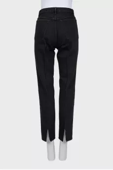 Black jeans with slits at the bottom