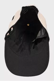 Black and beige cap