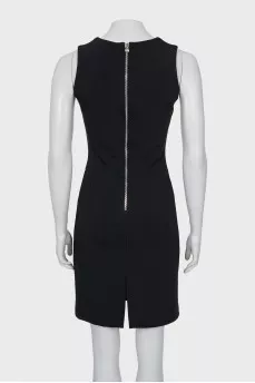 The fitted dress is decorated with lacing
