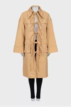 Beige trench coat with ties