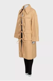 Beige trench coat with ties