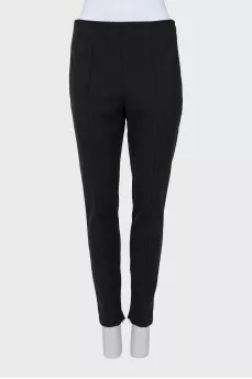Tapered trousers with zippers at the bottom