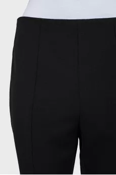 Tapered trousers with zippers at the bottom