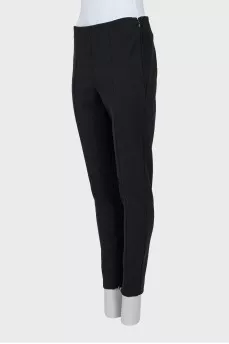 Tapered trousers with zippers at the bottom