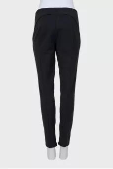 Tapered trousers with zippers at the bottom