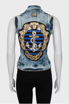 Denim vest with crystals on the back