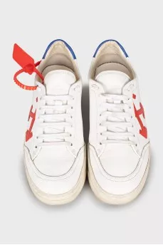White sneakers with branded decor