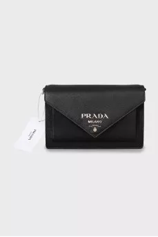 Black leather bag with tag