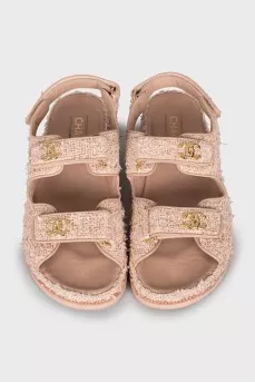 Pink sandals with gold logo
