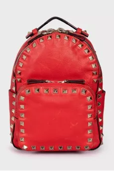 Leather backpack decorated with spikes