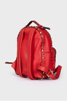 Leather backpack decorated with spikes