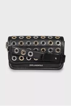 Leather bag decorated with eyelets