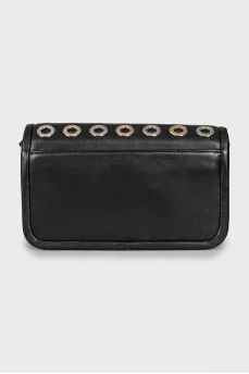 Leather bag decorated with eyelets