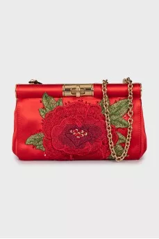 Clutch decorated with embroidery on a chain