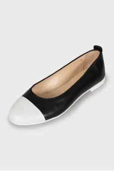 Black and white leather ballet flats