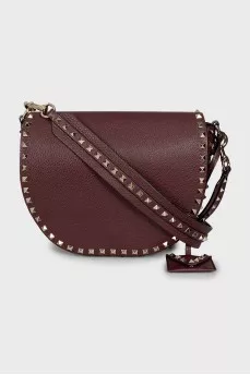 Dark red bag with metallic decor