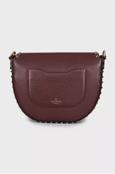 Dark red bag with metallic decor