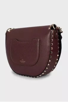 Dark red bag with metallic decor