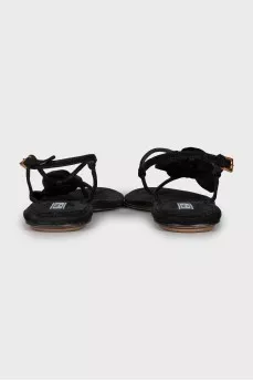 Suede flip flops decorated with a flower