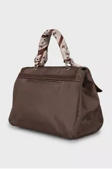 Textile bag decorated with a scarf