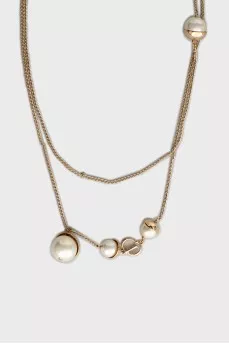 Golden pendant with beads