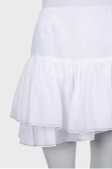 Skirt with rhinestones on the hem with a tag
