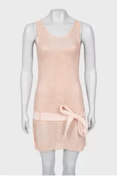 Pink dress decorated with a bow