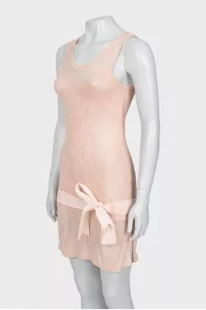 Pink dress decorated with a bow