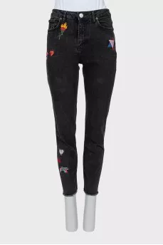 Jeans with raw edges and embroidery