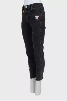 Jeans with raw edges and embroidery