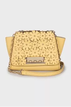 Leather bag decorated with flowers