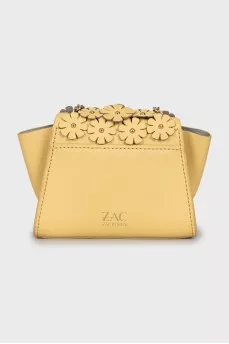 Leather bag decorated with flowers