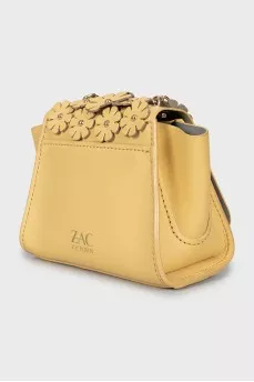 Leather bag decorated with flowers